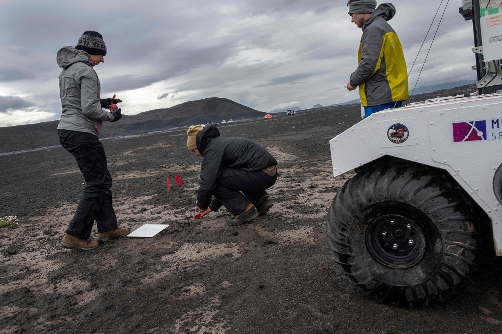 In this picture taken on July 19, 2019 shows scientists working at the Nasa base at the Lambahraun lava field in Iceland where they are getting their new robotic space explorer ready for the next mission to Mars. — AFP pic          