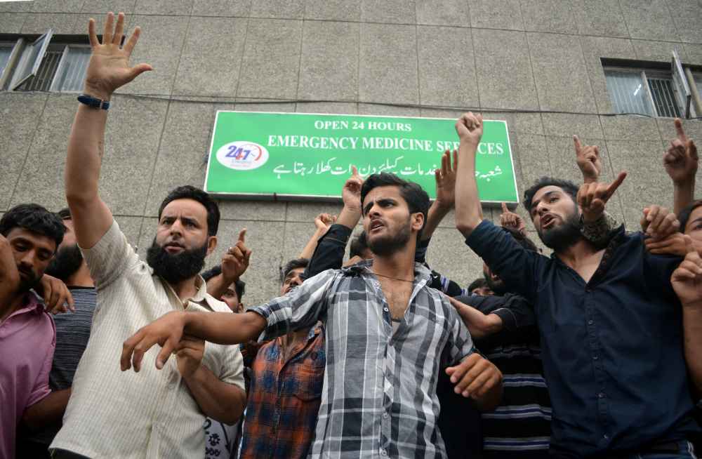 Demonstrators shout slogans outside a hospital emergency unit during a protest after the Indian government scrapped special status for Kashmir, in Srinagar August 9, 2019. u00e2u20acu2022 Reuters pic