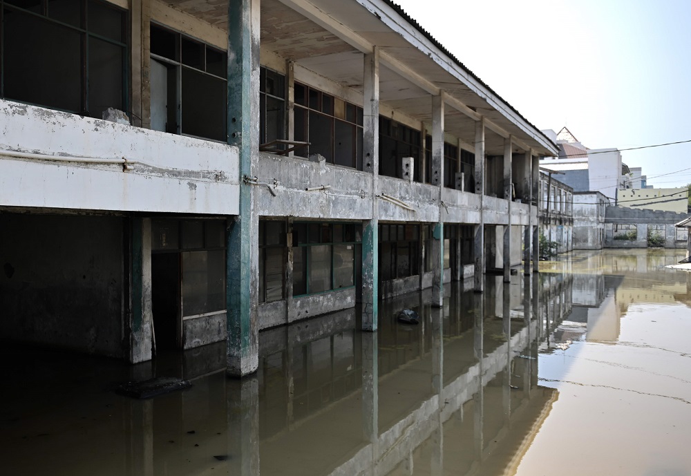 In this picture taken on July 26, 2019, shops are submerged as seen in northern Jakarta. — AFP pic           