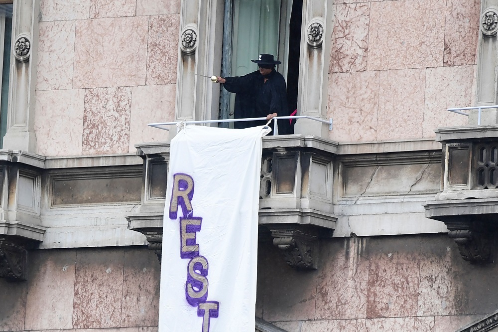 A man dressed as Zorro displays a banner that reads u00e2u20acu02dcStay Humanu00e2u20acu2122 from a balcony over Milan's Piazza del Duomo during a meeting of nationalist leaders on May 18, 2019. u00e2u20acu201d AFP pic         