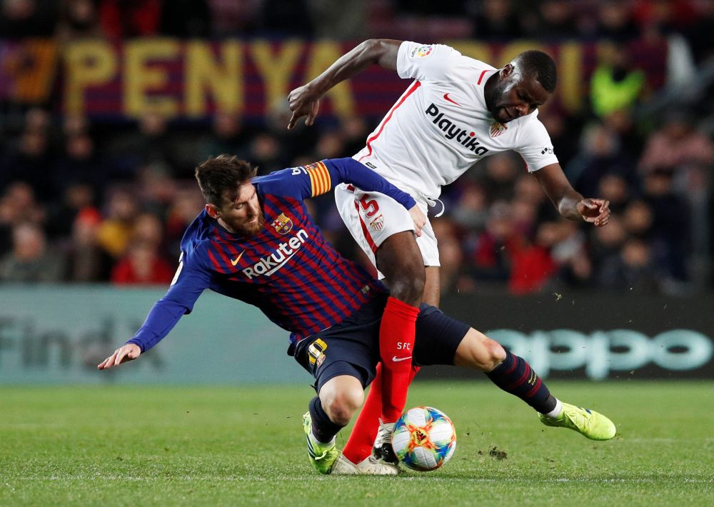 Barcelona's Lionel Messi in action with Sevilla's Ibrahim Amadou in the Copa Del Ray quarter-final January 30, 2019. u00e2u20acu201d Reuters pic