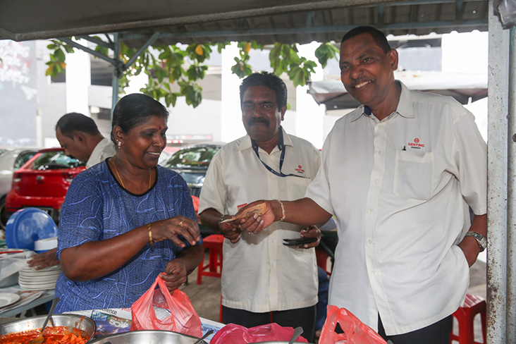 The stall has many regulars like Chandra Segaran (middle) and Mogan Sathia Sivam (right) who have been eating here since 1985!