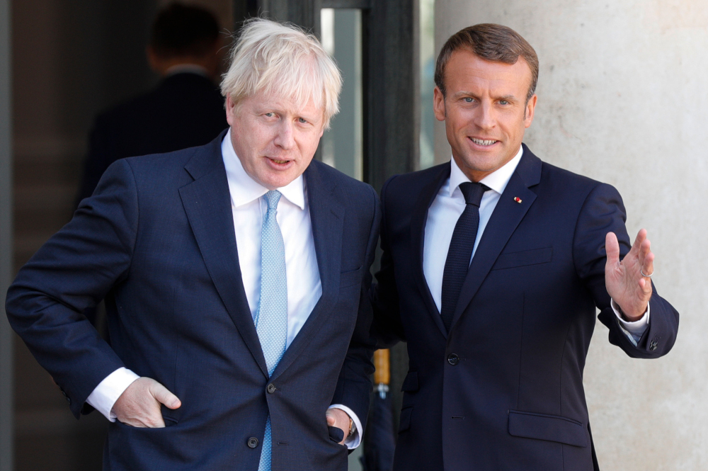 French President Emmanuel Macron welcomes Britainu00e2u20acu2122s Prime Minister Boris Johnson prior to their meeting at The Elysee Palace in Paris August 22, 2019. u00e2u20acu201d AFP pic