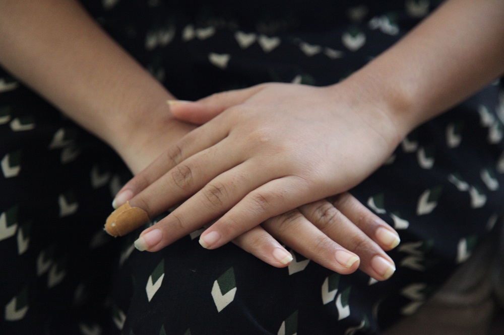 A young Nepali woman, who was rescued by police from a dance bar in a suspected human trafficking case, sits in a safe house in Kenyau00e2u20acu2122s coastal city of Mombasa July, 15, 2019. u00e2u20acu201d Thomson Reuters Foundation pic