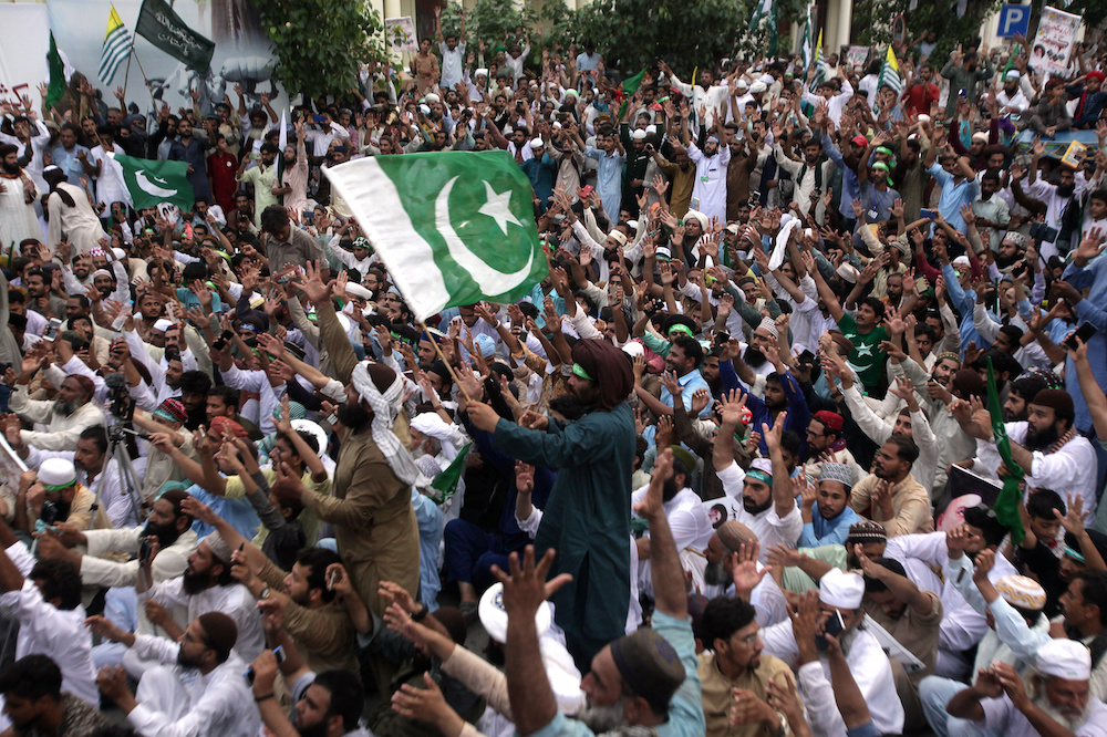 Supporters of the Tehrik-e-Labaik Pakistan Islamic political party raise their hands and chant slogans during a rally to express solidarity with the people of Kashmir, in Lahore, Pakistan August 9, 2019. u00e2u20acu201d Reuters picnn
