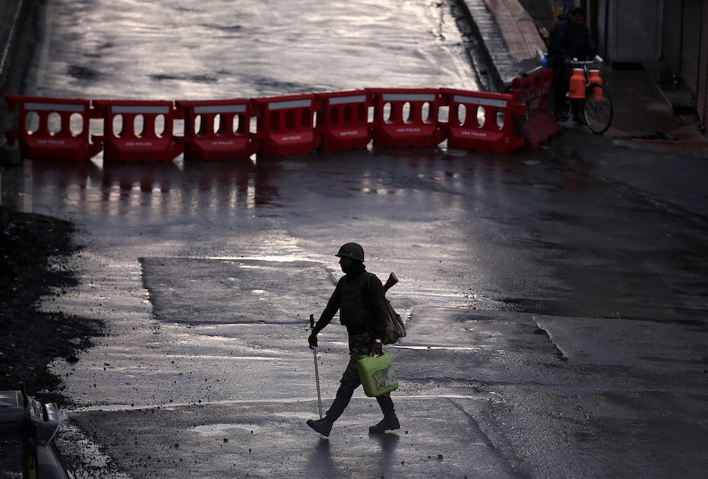 An Indian security force personnel patrols a deserted road during restrictions after the government scrapped special status for Kashmir, in Srinagar August 8, 2019. u00e2u20acu201d Reuters pic