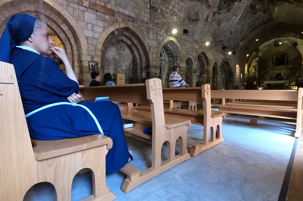 A nun looks on as people visit the Monastery of Saint Anthony of Qozhaya in the heart of the Qadisha valley, in Zgharta district, Lebanon June 23, 2019. — Reuters pic