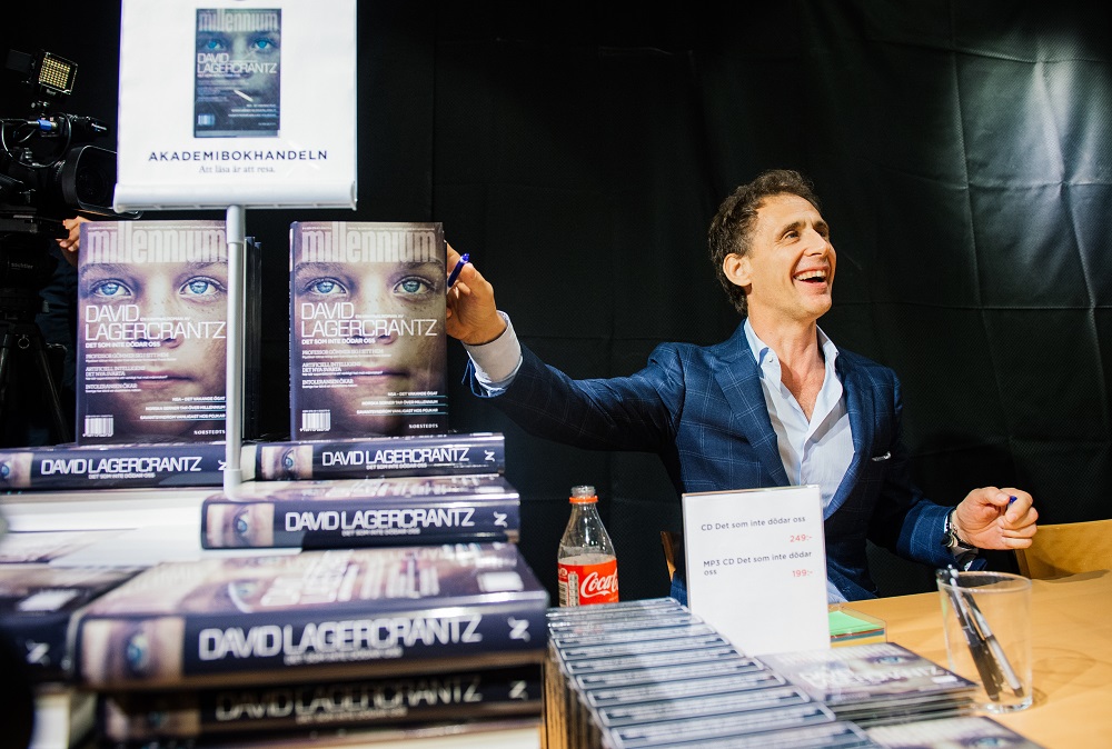 In this file photo taken on August 28, 2015, the author of the fourth novel in the u00e2u20acu02dcMillenniumu00e2u20acu2122 series of crime novels, Swedish journalist and best-selling author, David Lagercrantz, signs books at a local book store in Stockholm. u00e2u20acu201d AFP pic
