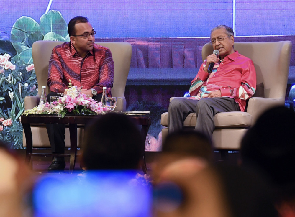 Prime Minister Tun Dr Mahathir Mohamad with townhall moderator Datuk Mohd Rafiq Naizamohideen during the Semarak Merdeka Town Hall dialogue session in Bandar Hilir, Melaka August 3, 2019. u00e2u20acu201d Bernama pic