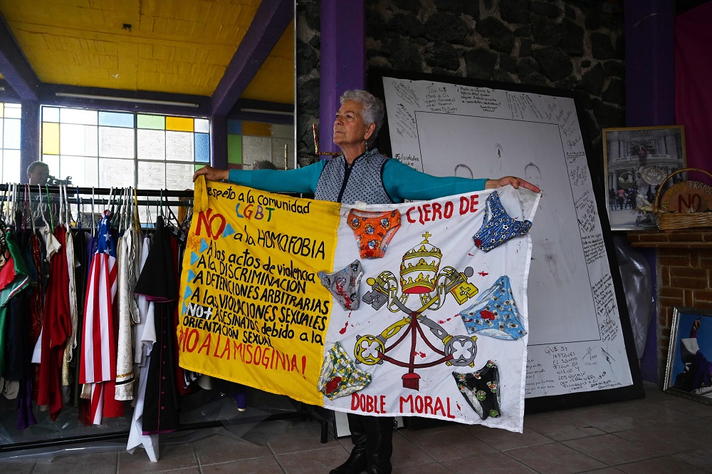 Mexican activist Julia Klug poses with a banner against homophobia in Mexico City August 8, 2019. u00e2u20acu201d AFP pic       