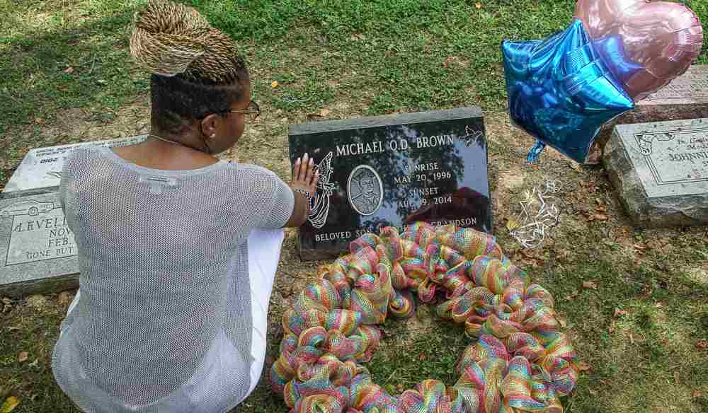 Lezley McSpadden, mother of Michel Brown Jr, puts her hand on his tombstone on the 5th anniversary of his passing in Normandy, Missouri August 9, 2019. u00e2u20acu2022 Reuters pic