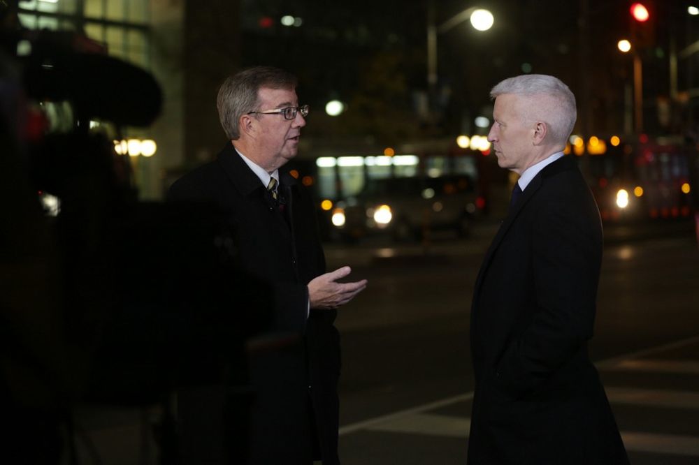 In this file photo taken on October 22, 2014, Ottawa Mayor Jim Watson (left) talks to CNNu00e2u20acu2122s Anderson Cooper on live television blocks away from Parliament Hill in Ottawa, Canada. u00e2u20acu201d AFP pic