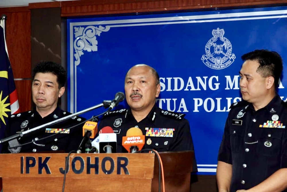 Johor police chief Datuk Mohd Kamarudin Md Din (centre) said there is no concrete evidence that toxic waste was responsible for making 33 pupils from SK Taman Pasir Putih in Pasir Gudang sick. u00e2u20acu201d Picture by Ben Tan