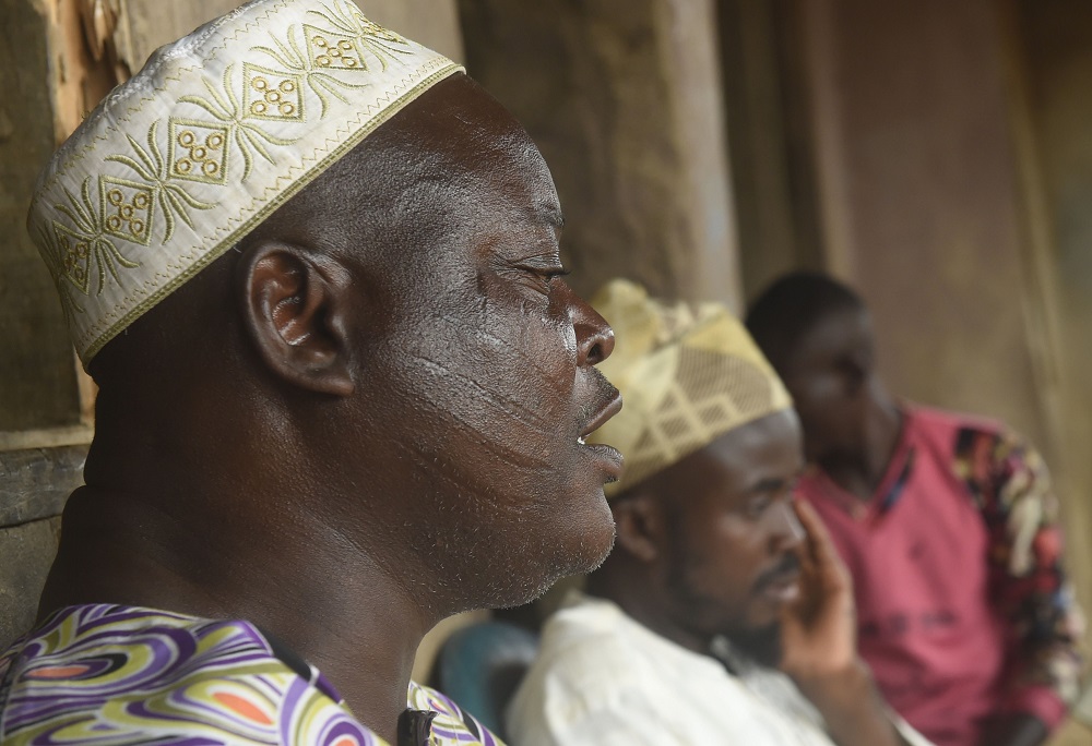 A man bearing tribal marks on his cheeks speaks in Ibadan, southwest Nigeria July 1, 2019. — AFP pic        