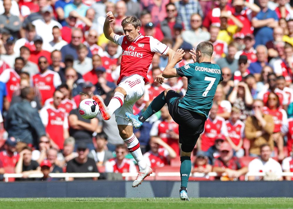 Arsenalu00e2u20acu2122s Nacho Monreal in action with Burnleyu00e2u20acu2122s Johann Berg Gudmundsson during their Premier League match in Emirates Stadium, London, August 17, 2019. u00e2u20acu201d Bernama pic
