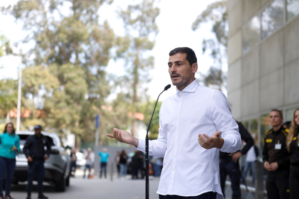 Spanish soccer player Iker Casillas speaks to journalists before he leaves CUF Porto hospital accompanied by his wife Sara Carbonero in Porto, Portugal May 6, 2019. u00e2u20acu201d Reuters pic