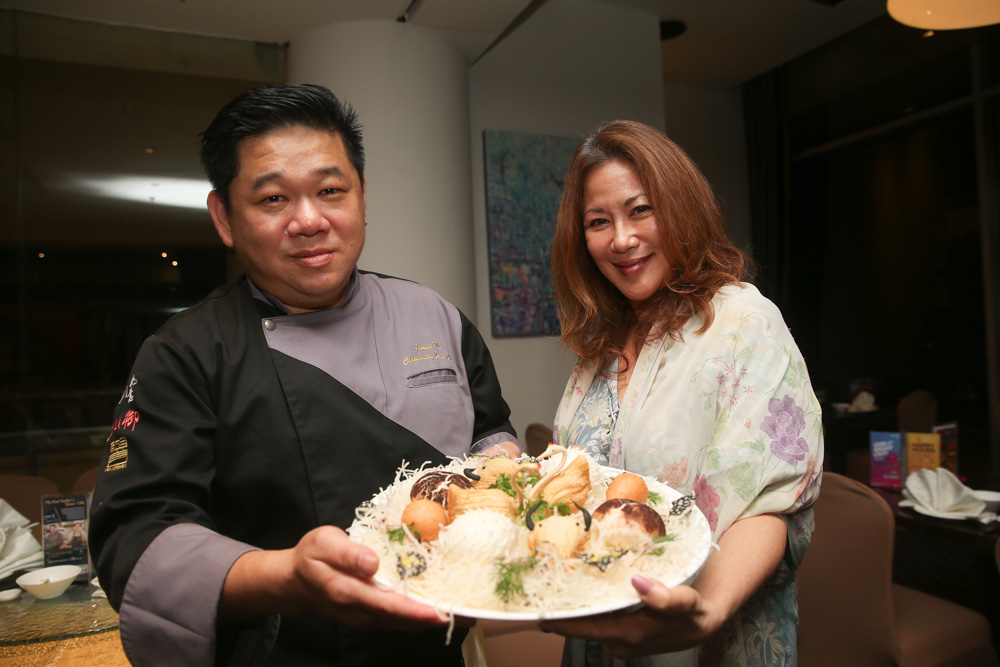 Ruyi executive chef James Ho and SPCA Selangor chairman Christine Chin present the platter at the media preview yesterday. — Picture by Choo Choy May