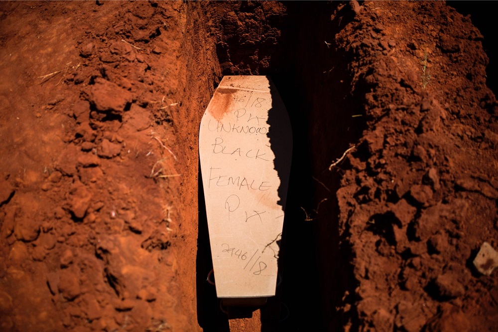 The coffin of an unidentified black woman is pictured as municipal Johannesburg Morgue workers proceed to its burial at the Olifantsvlei Cemetery in Johannesburg February 27, 2019. — AFP pic