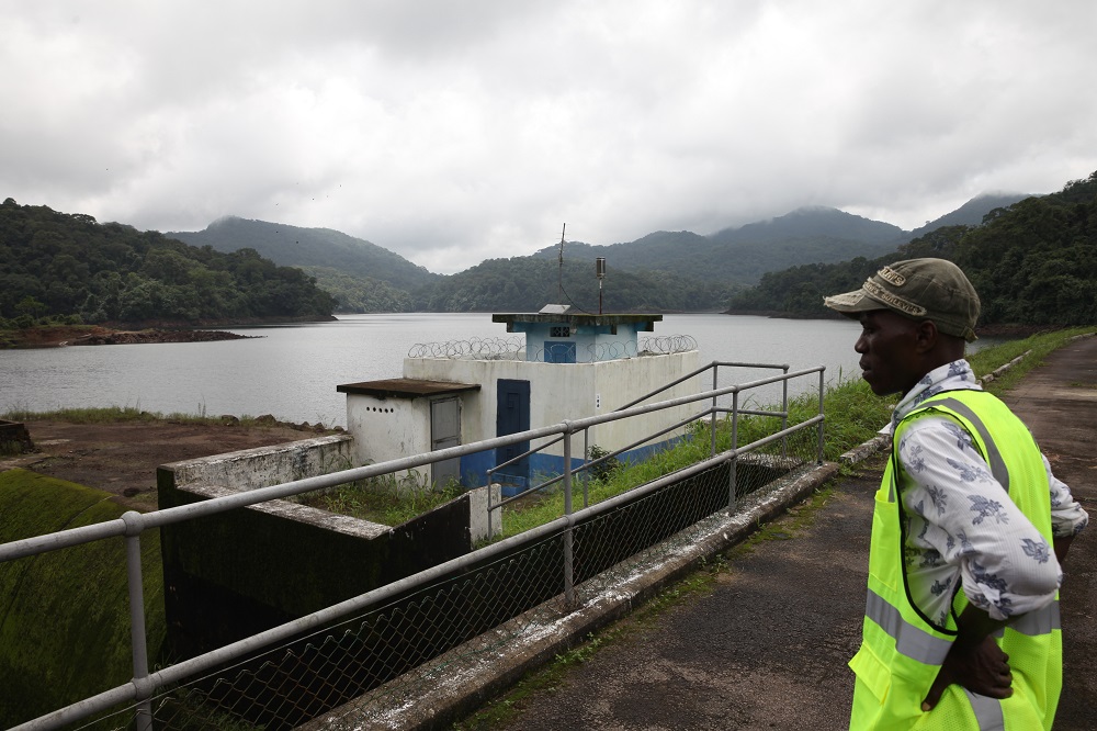 Clifford Coomber is pictured in front of Guma Dam, the main source of water for Freetown. Western Area, Sierra Leone July 30, 2019. u00e2u20acu201d Thomson Reuters Foundation pic