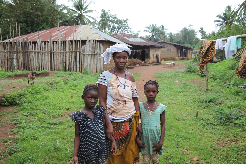 Fatimata Kamara poses with her daughters in the village of Thawuya, Port Loko district, Sierra Leone July 23, 2019. u00e2u20acu201d Thomson Reuters Foundation pic