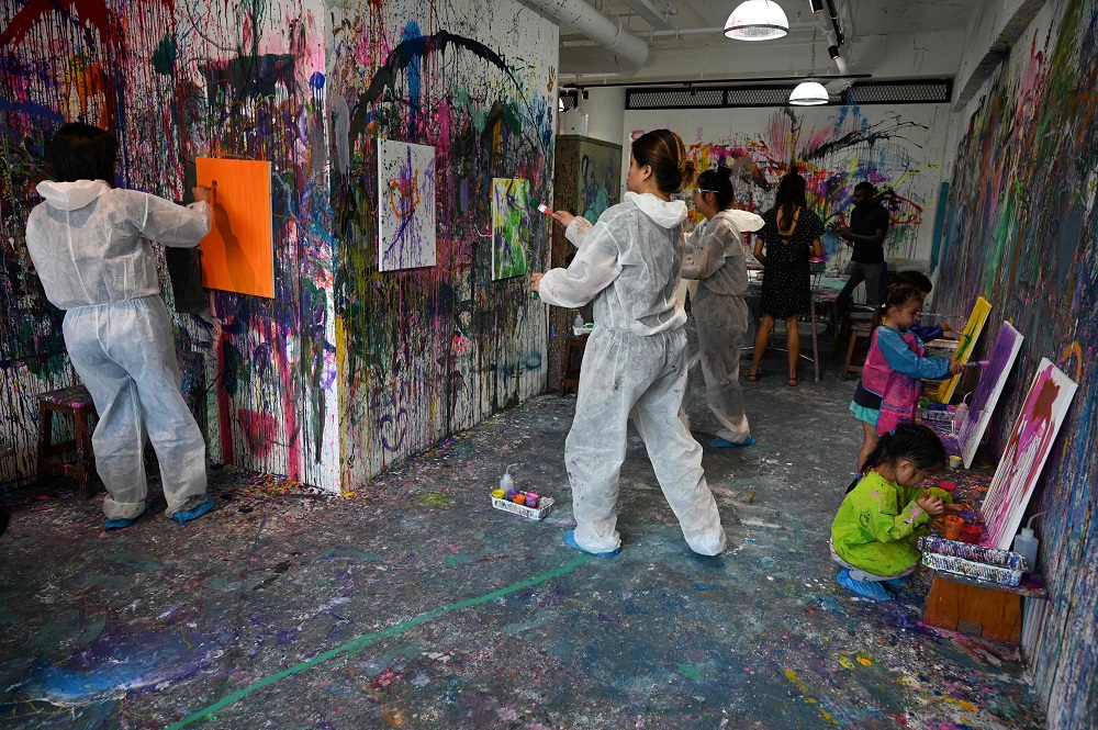 This picture taken on August 1, 2019, shows patrons creating watercolour and acrylic paintings at Splat Paint House in Singapore. u00e2u20acu201d AFP pic  