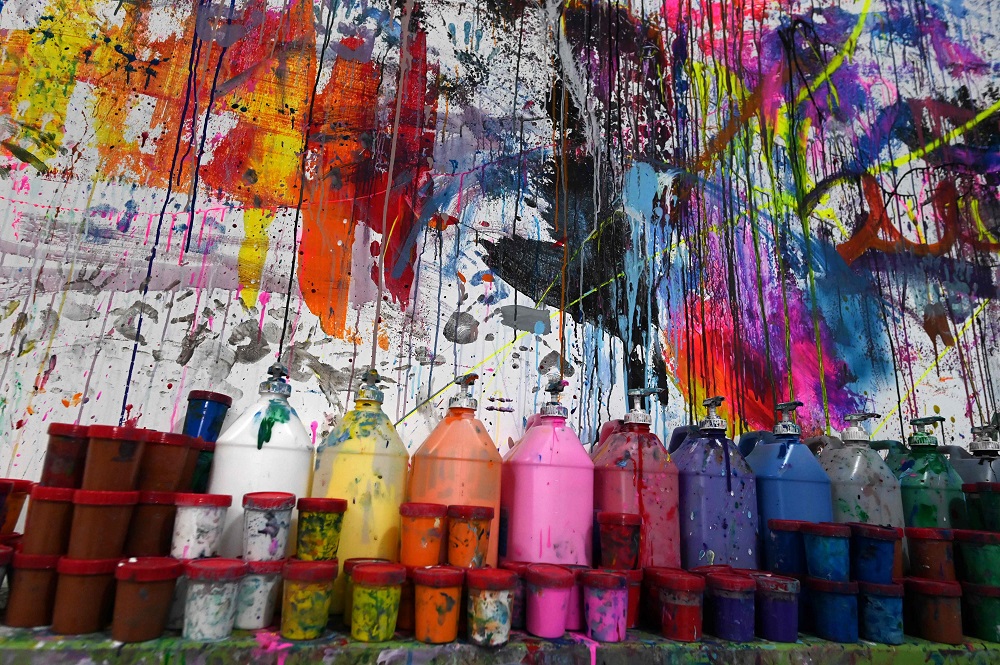 This picture taken on August 1, 2019, shows watercolour and acrylic paints lined up against a wall at Splat Paint House in Singapore. — AFP pic