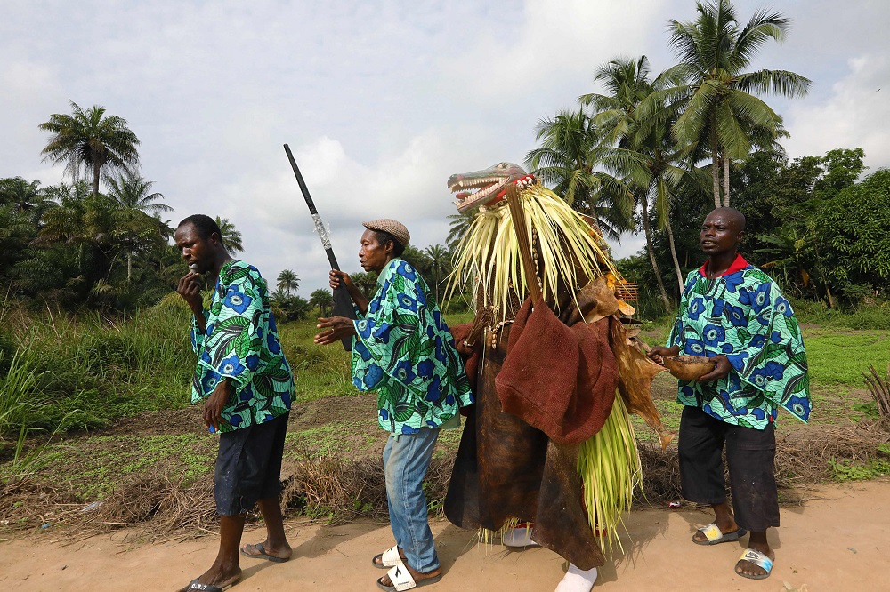 The menu00e2u20acu2122s secret hunting society members of Songo village begin their processional through town on December 7, 2018. u00e2u20acu201d AFP pic  