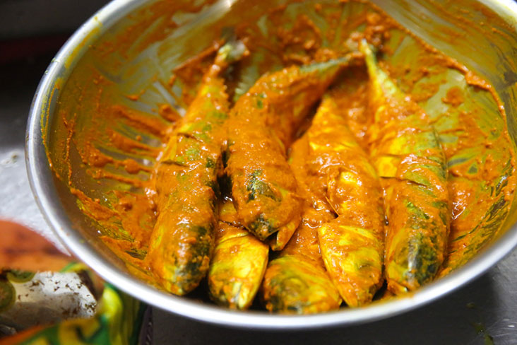 Fresh fish is marinated in a concoction of spices before it is fried.