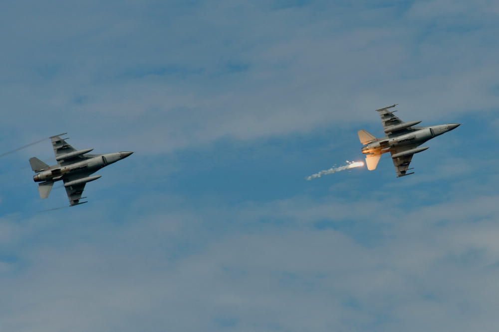 In this file photo taken May 30, 2019 a US-made F-16 fighter jet (right) launches a flare during the 35th u00e2u20acu02dcHan Kuangu00e2u20acu2122 (Han Glory) military drill in southern Taiwanu00e2u20acu2122s Pingtung county. u00e2u20acu201d AFP pic