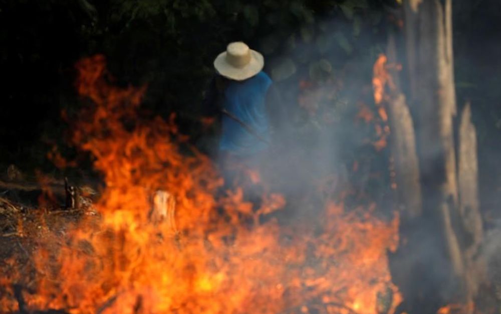 A man works in a burning tract of Amazon jungle as it is being cleared by loggers and farmers in Iranduba, Amazonas state, Brazil, August 20, 2019. u00e2u20acu201d Reuters pic