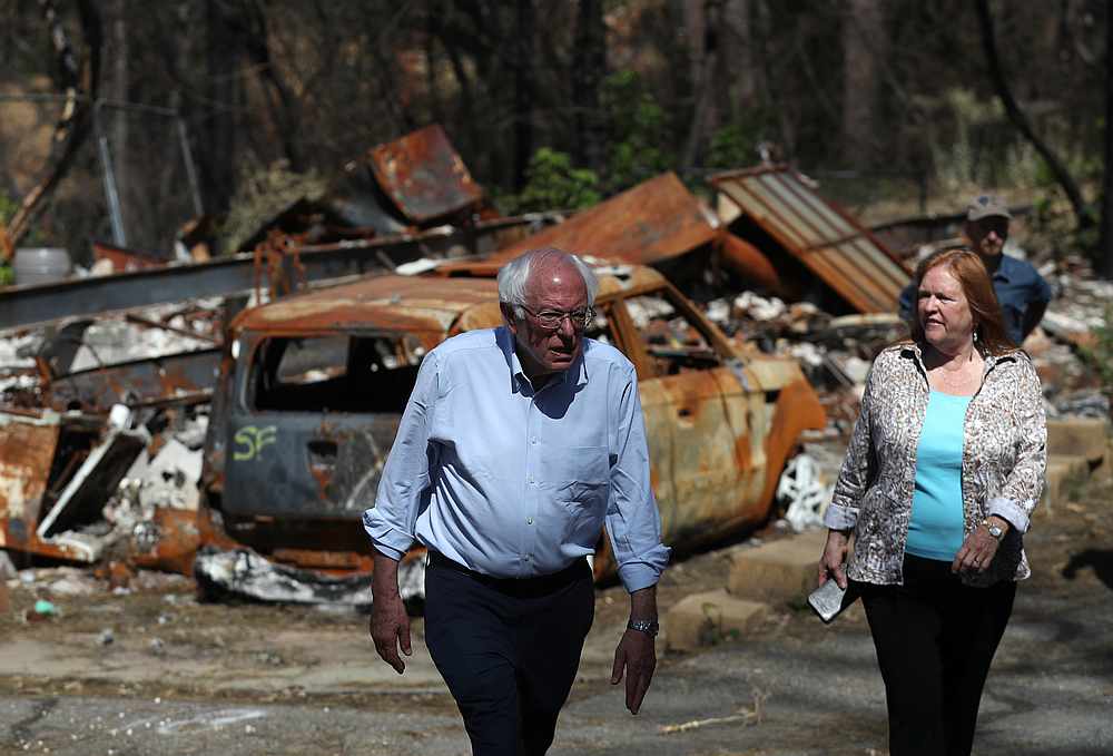Democratic presidential candidate Bernie Sanders and wife Jane Sanders tour a mobile home park that was destroyed by the Camp Fire August 22, 2019 in Paradise, California. u00e2u20acu201d AFP pic