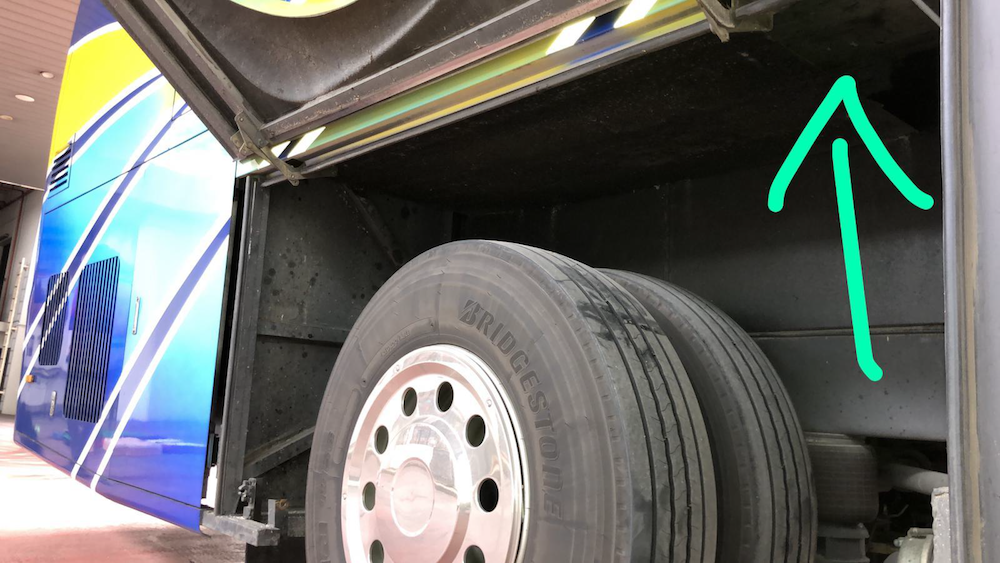 The Malaysia-registered bus had modified compartments above its rear tyres. — Handout via TODAY