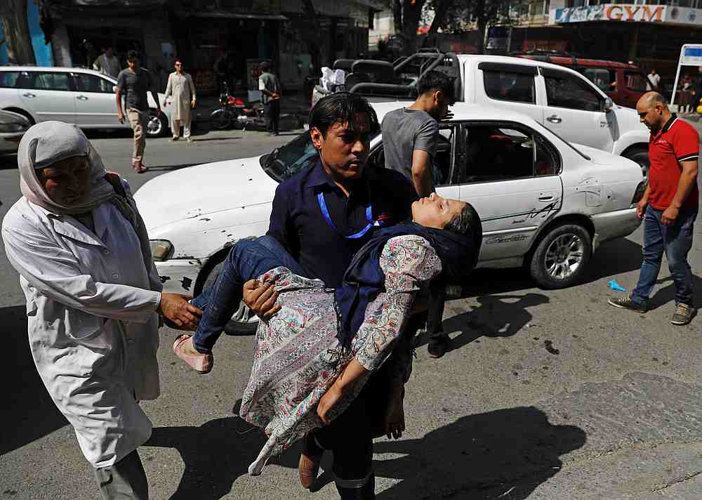 A man carries an injured woman to a hospital after a blast in Kabul, Afghanistan August 7, 2019. u00e2u20acu201d Reuters pic