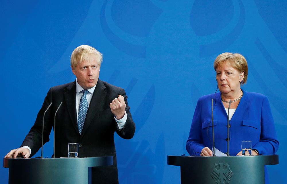 Britain's Prime Minister Boris Johnson gestures as German Chancellor Angela Merkel listens during a news conference at the Chancellery in Berlin, Germany August 21, 2019. u00e2u20acu201d Reuters pic