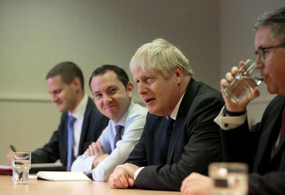 Britainu00e2u20acu2122s Prime Minister Boris Johnson talks with prison staff during a visit to HM Prison Leeds, a Category B menu00e2u20acu2122s prison in Leeds, England, on August 13, 2019. u00e2u20acu201d AFP pic
