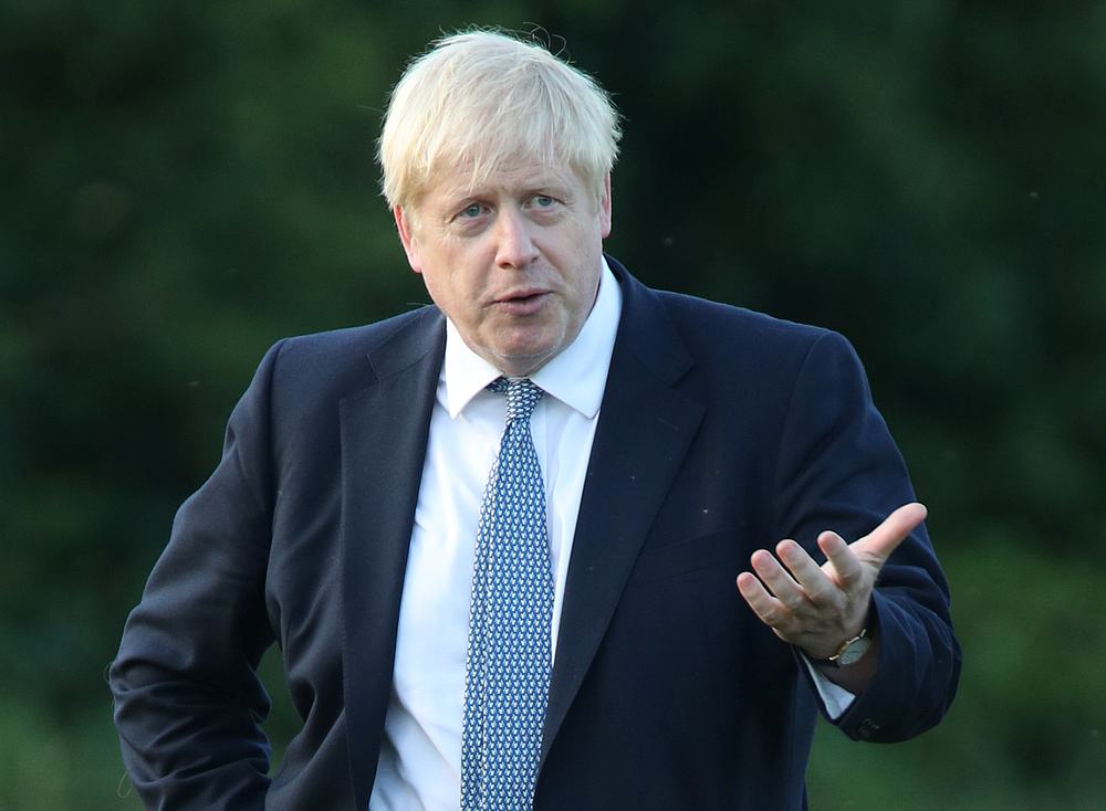 Britain's Prime Minister Boris Johnson arrives to meet emergency crews during a visit to Whaley Bridge Football Club in Derbyshire, Britain August 2, 2019. u00e2u20acu201d Yui Mok/Pool pic via Reuters
