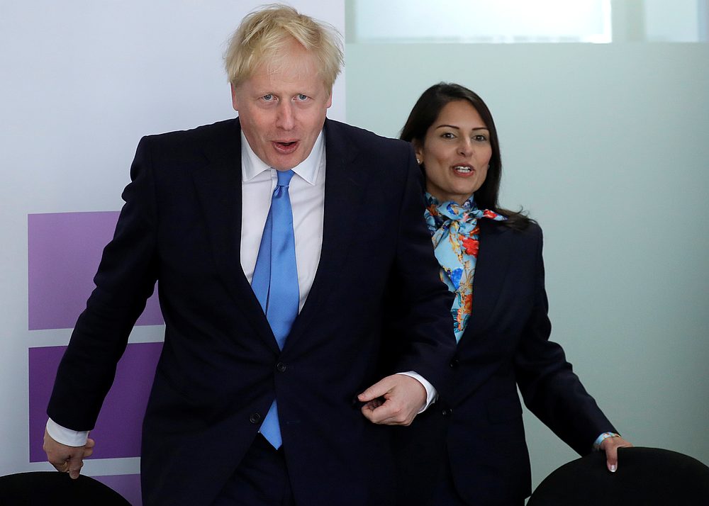 Britain's Prime Minister Boris Johnson and Home Secretary Priti Patel attend the first meeting of the National Policing Board at the Home Office in London July 31, 2019. u00e2u20acu201d Kirsty Wigglesworth/Pool pic via Reuters