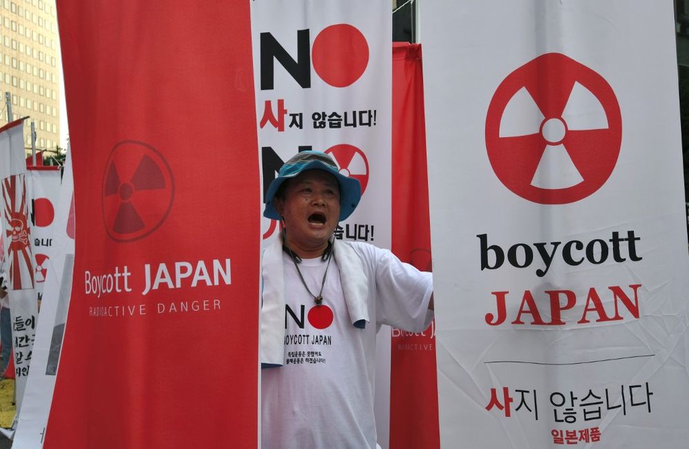 A protester holding anti-Japanese banners during a rally against Japanu00e2u20acu2122s decision to remove South Korea from a so-called u00e2u20acu02dcwhite listu00e2u20acu2122 of favoured export partners, near the Japanese embassy in Seoul, August 3, 2019. u00e2u20acu201d AFP pic