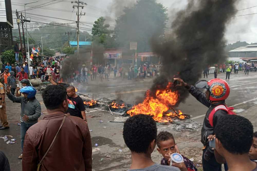 People burn tires during a protest at a road in Manokwari, West Papua, Indonesia August 19, 2019. u00e2u20acu201d Antara Foto/Toyiban pic via Reuters