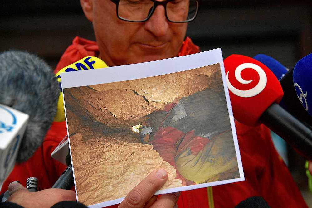 A rescue team representive shows a picture from a search operation for two cave climbers trapped in the Tatra mountains during a news conference in Zakopane, Poland August 21, 2019. u00e2u20acu201d Agencja Gazeta/Marek Podmokly pic via Reuters