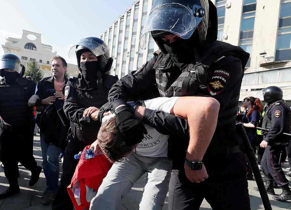 Law enforcement officers detain a participant in a rally calling for opposition candidates to be registered for elections to Moscow City Duma, the capital's regional parliament August 3, 2019. u00e2u20acu201d Reuters pic