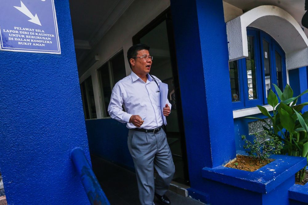 Dong Zong honorary secretary Ng Chai Heng arrives at Bukit Aman police headquarters in Kuala Lumpur August 22, 2019. u00e2u20acu201d Picture by Hari Anggara