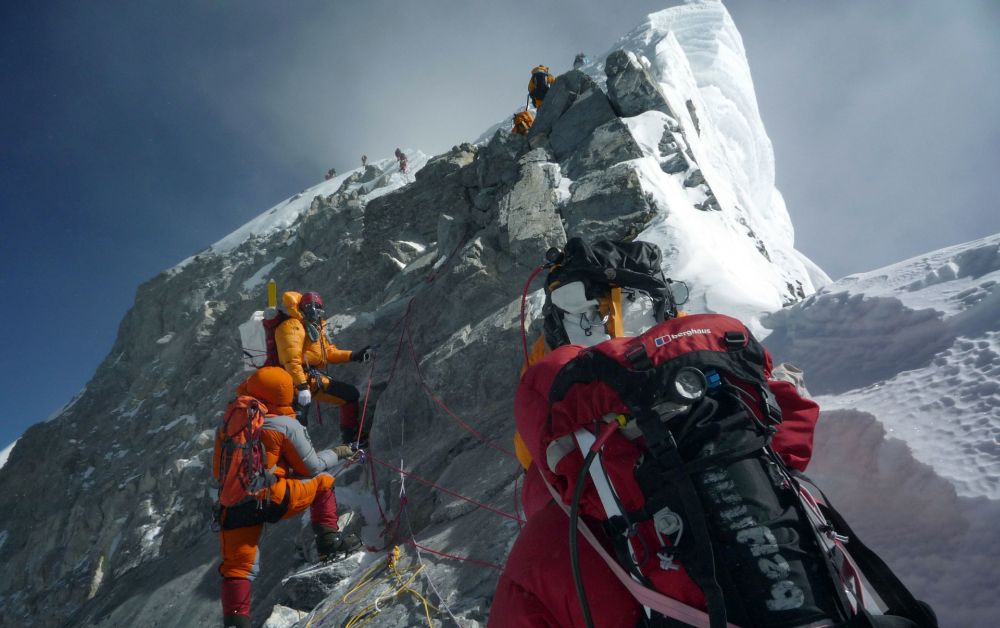 Mountaineers walk past the Hillary Step while pushing for the summit of Mount Everest. u00e2u20acu201d AFP pic