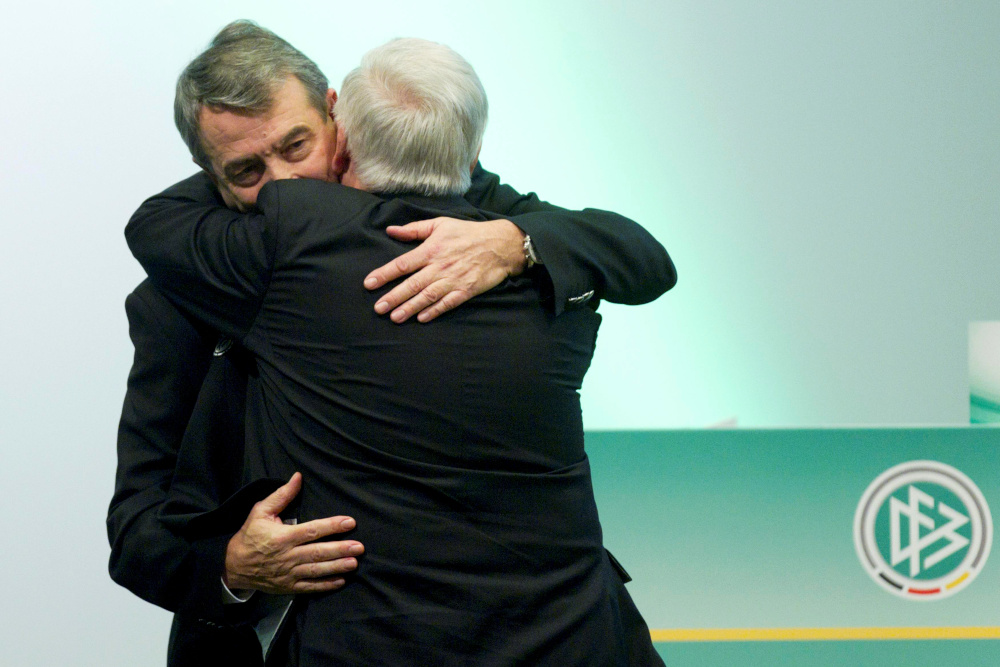 Wolfgang Niersbach (left), new president of the German soccer association (DFB), embraces Theo Zwanziger, former DFB president after being elected during a general meeting in Frankfurt in this March 2, 2012 file picture. u00e2u20acu201d Action Images via Reuters 
