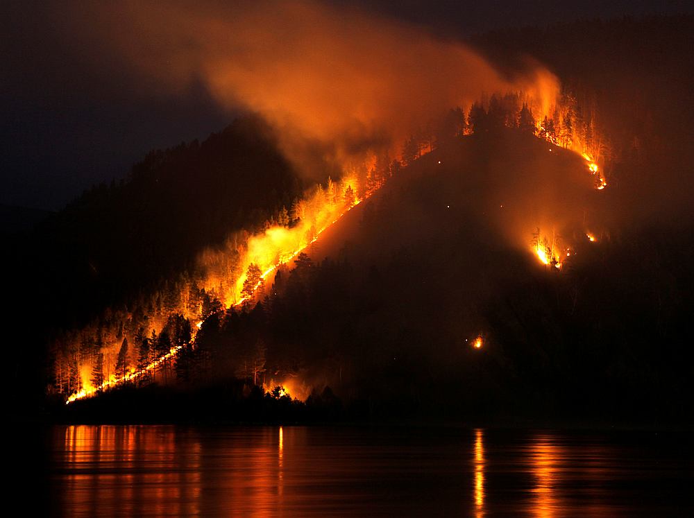Dry grass, bushes and trees burn on the bank of the Yenisei River in Taiga district, near Russia's Siberian city of Krasnoyarsk April 21, 2011. Russia faces a constant danger of forest fires in Siberia and its far east. u00e2u20acu201d  Reuters pic