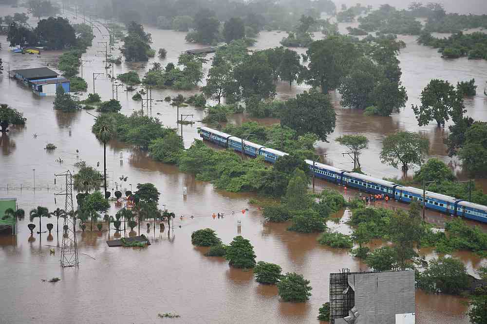An aerial view shows a stranded passenger train in a flooded area near Badlapur, in the western state of Maharashtra, India, July 27, 2019. u00e2u20acu201d Indian Navy handout via Reuters