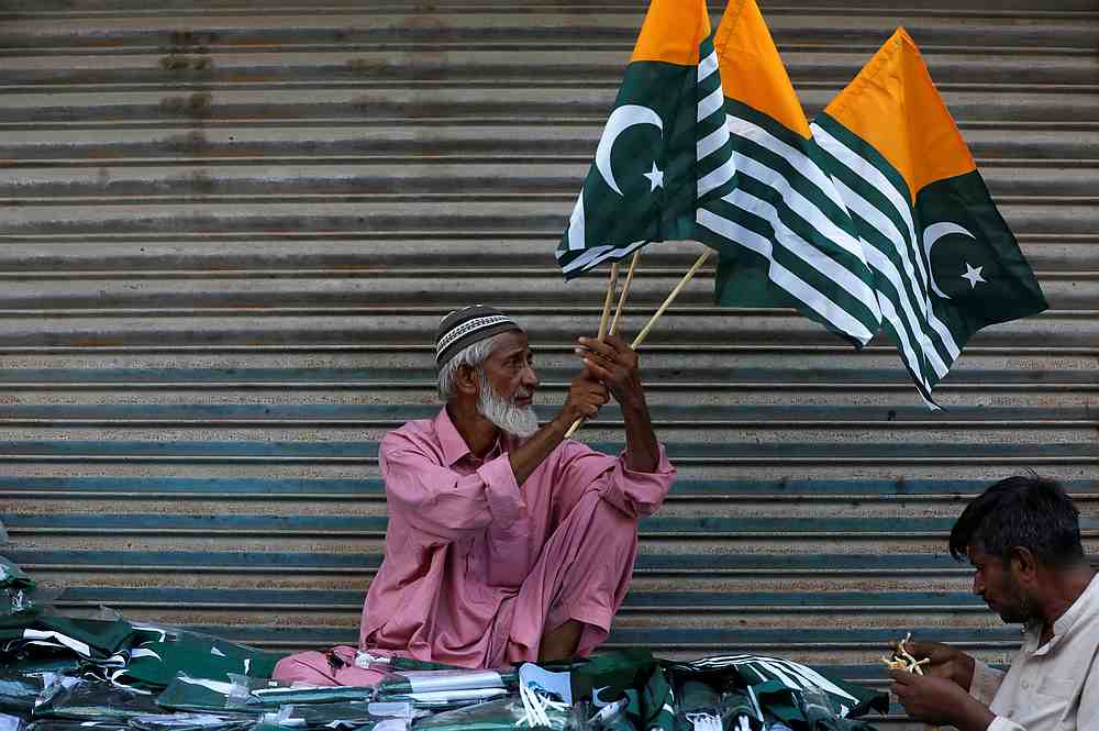 A man sells Kashmir's flags and patriotic memorabilia ahead of Pakistan's Independence Day, along a market in Karachi August 13, 2019. u00e2u20acu201d Reuters pic