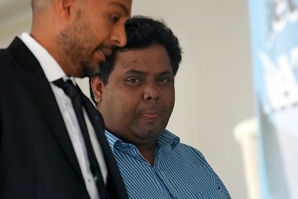Vijayan Mathan Gopal (right) was convicted of three charges of molesting a flight attendant in November 2017 during a Scoot flight from Cochin, India to Singapore. u00e2u20acu201d TODAY pic