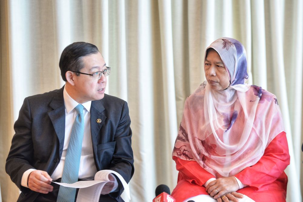 Finance Minister Lim Guan Eng and Housing and Local Government Minister Zuraida Kamaruddin are pictured during a press conference in Putrajaya August 22, 2019. u00e2u20acu201d Picture by Shafwan Zaidon