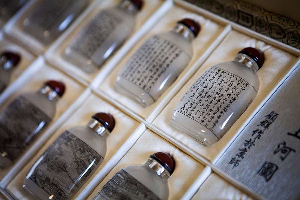 The back of an inside-painted bottle titled 'Along the River during the Qingming Festival' at the home of artists like Zhang Yuhua and her husband Gu Qun in Beijing July 1, 2019. u00e2u20acu201d AFP pic